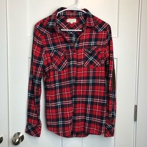 Red Plaid shirt with brown elbows.